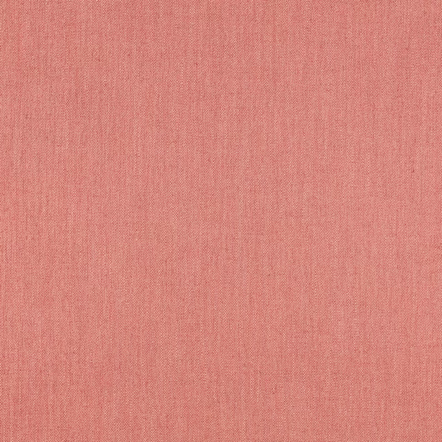 Close-up of coral-pink Ruskin fabric showing a fine, subtly striated weave