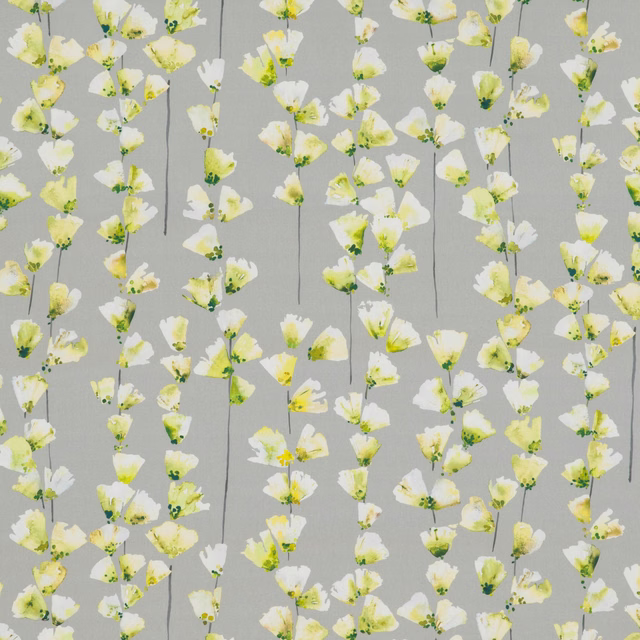 Soft grey fabric with scattered white, pale yellow and chartreuse hanging flowers