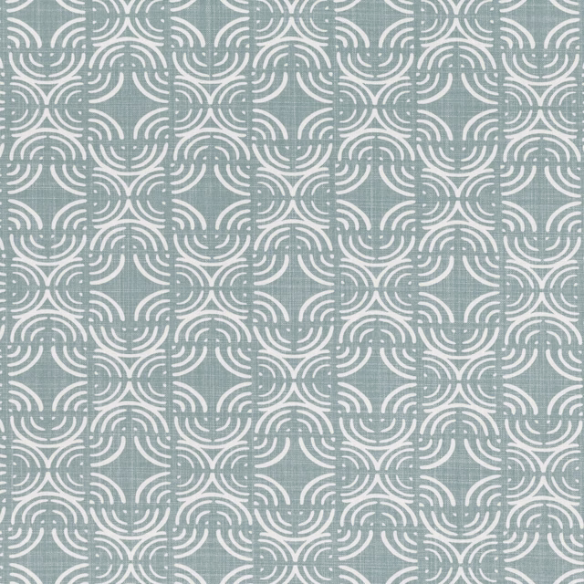 Muted blue-grey textile with cream interlocking curved motifs and softly textured surface