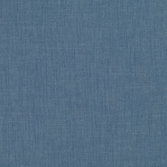 Muted denim-blue woven fabric with fine crosshatched texture and subtle tonal variation
