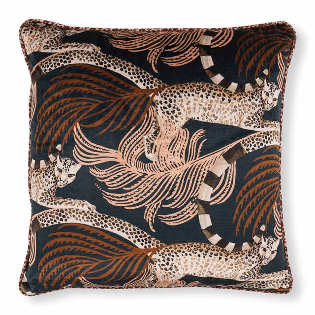 Deep teal velvet cushion with rust leopards, blush foliage and cream spotted forms