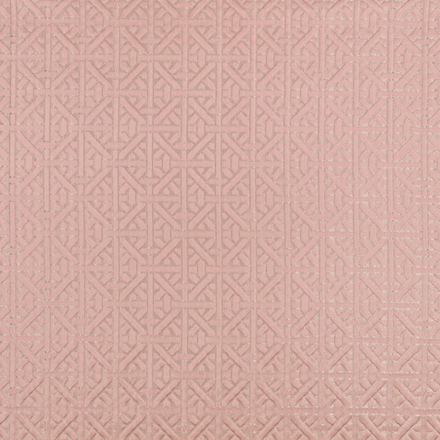 Dusty vintage rose fabric with a fine interlocking geometric weave and tonal texture