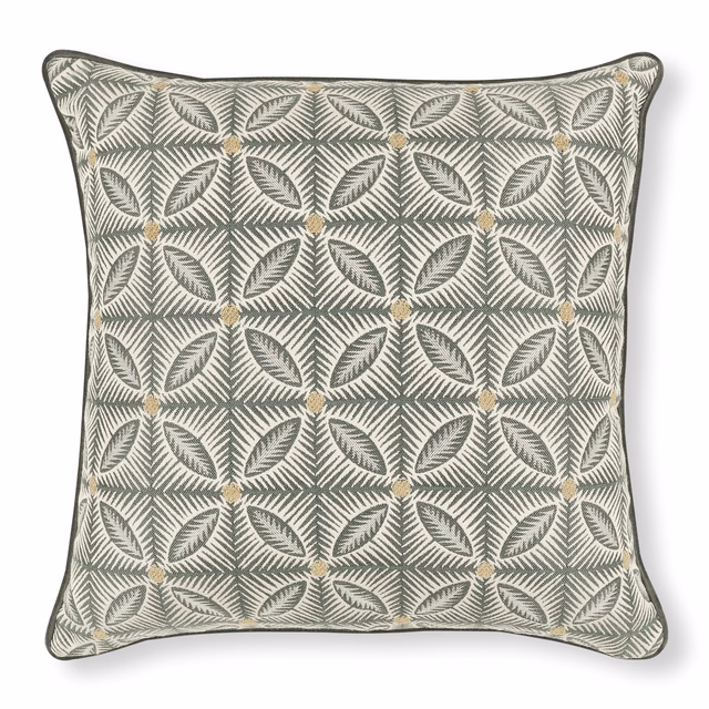 Silver-grey cushion with repeating fern leaves, angular lattice and warm gold diamond accents