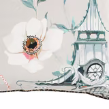 Pale grey fabric with coral-centred flower and teal clock-tower illustration