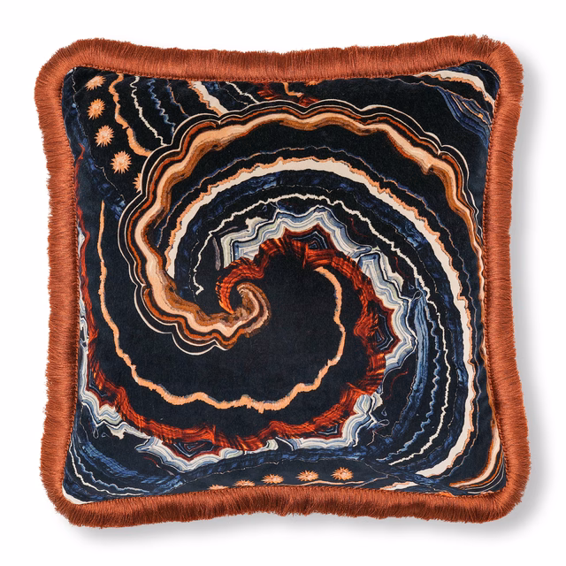 Dark navy spiral cushion with rust, cream and blue contour bands and fringe