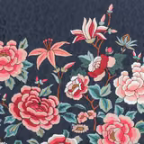 Large coral and cream flowers with teal leaves on a deep navy floral fabric