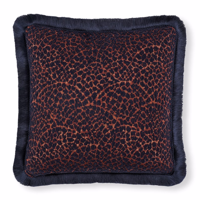 Dark navy cushion with copper-brown mottling and deep navy fringe