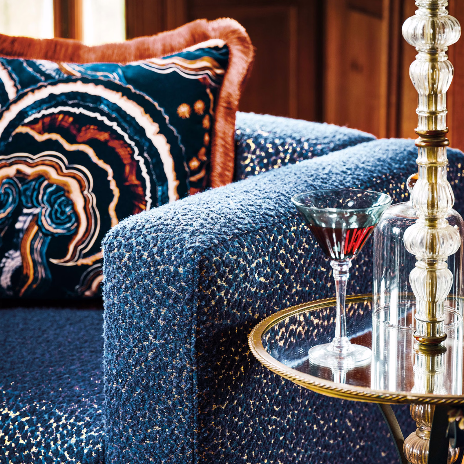 Deep indigo-blue nubby upholstery with pale flecks on a rounded chair