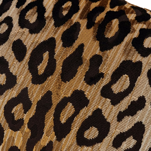 Warm tan velvet with bold black leopard rosettes and textured pile