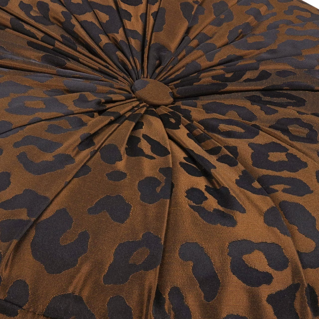 Warm copper fabric with charcoal organic spots and a soft woven sheen