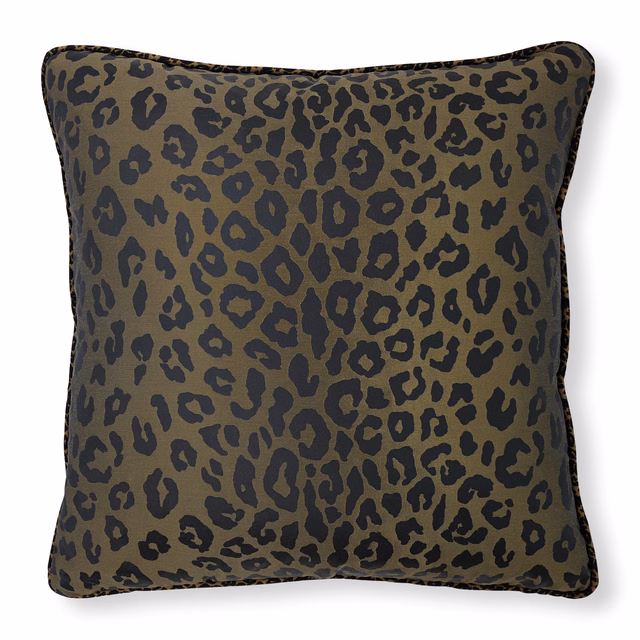 Muted olive khaki fabric with irregular charcoal leopard spots on a cushion