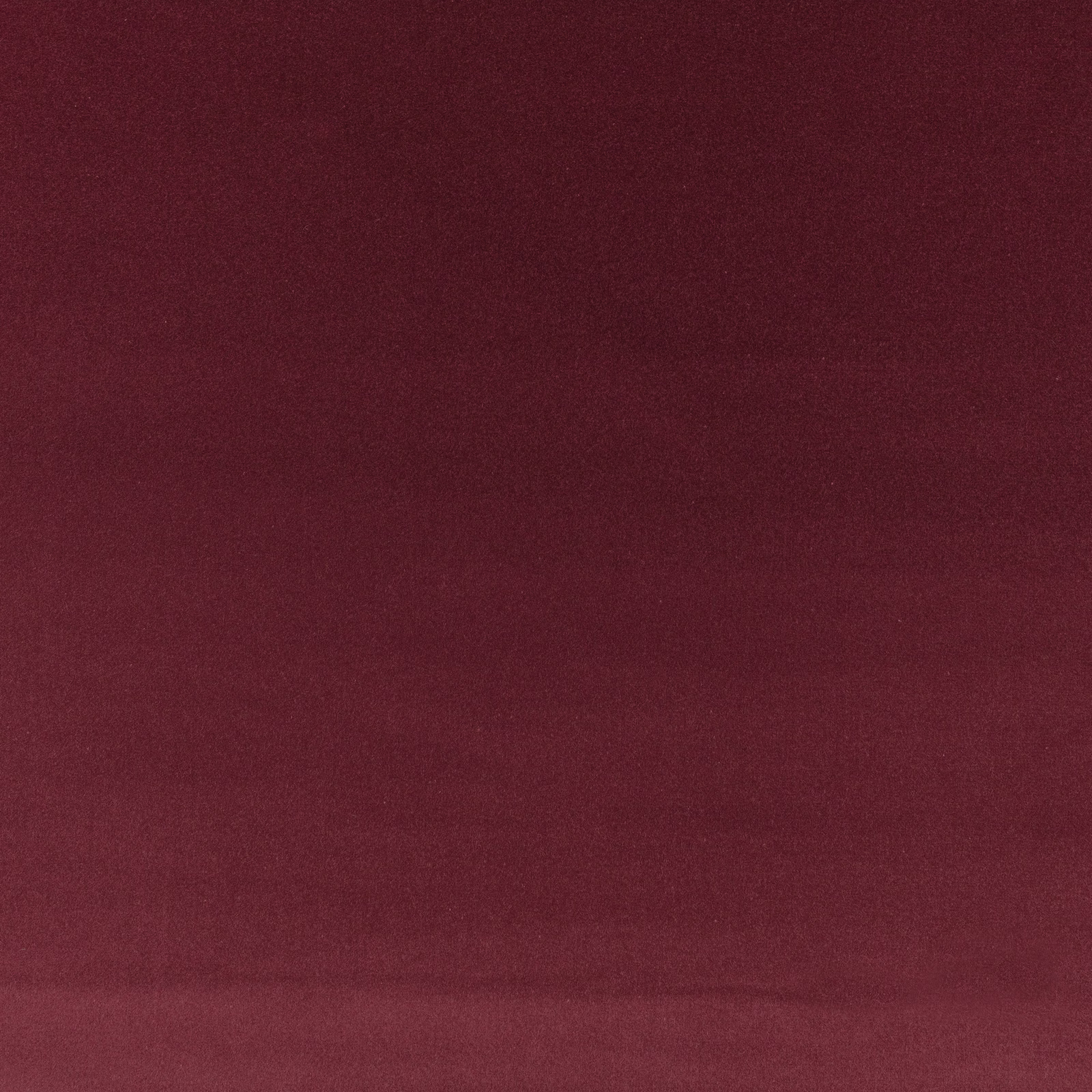 Deep wine-red plain velvet swatch with plush nap and subtle tonal sheen