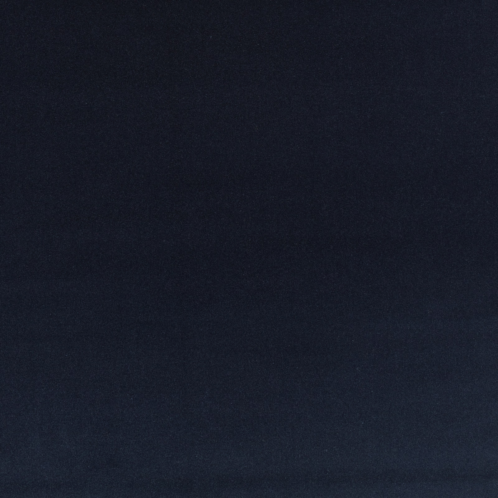 Close-up of deep midnight-blue plain velvet with a subtly shifting pile