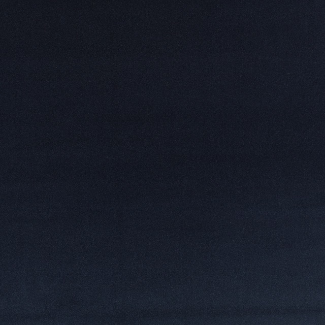 Close-up of deep midnight-blue plain velvet with a subtly shifting pile