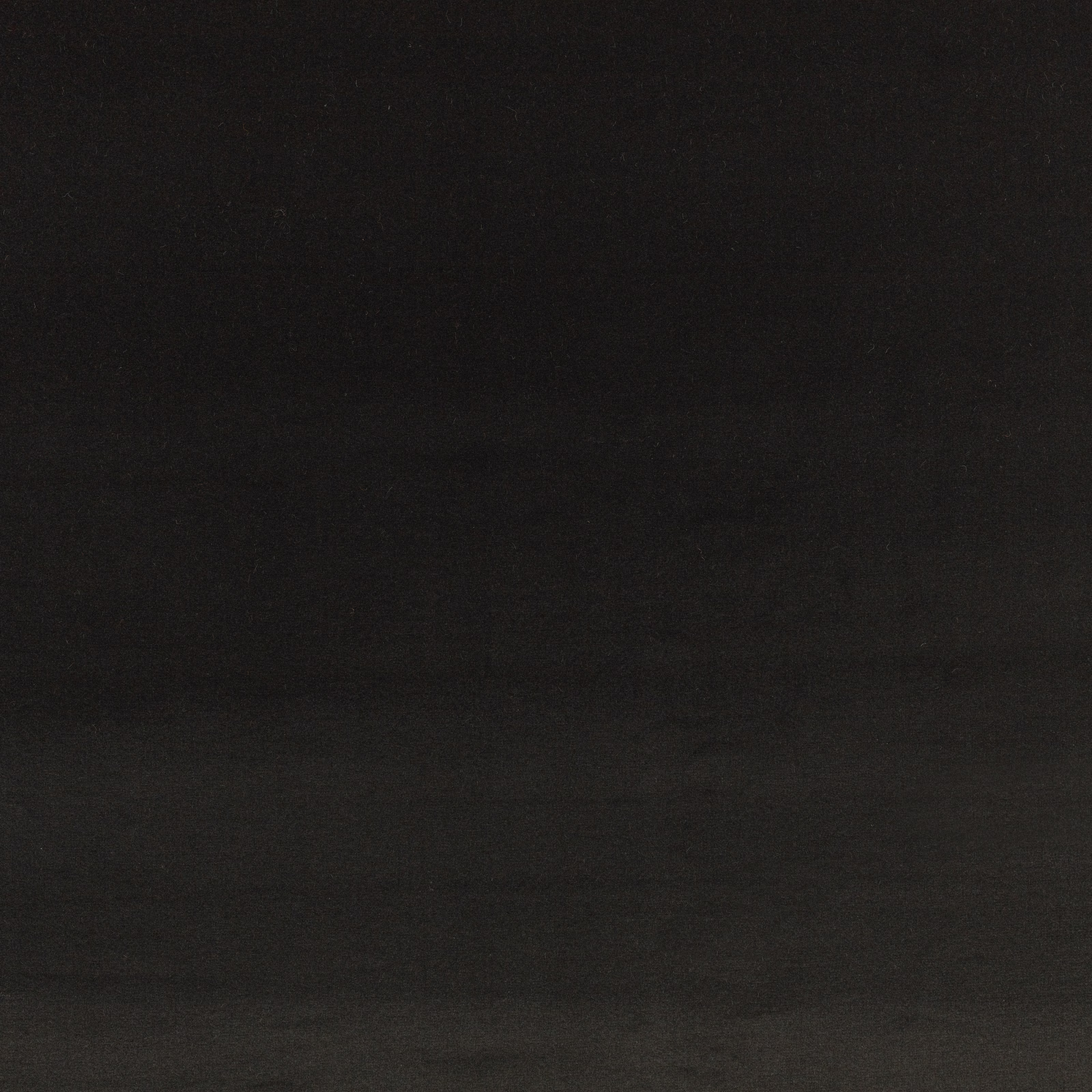 Near-black charcoal velvet swatch showing subtle nap and low directional sheen