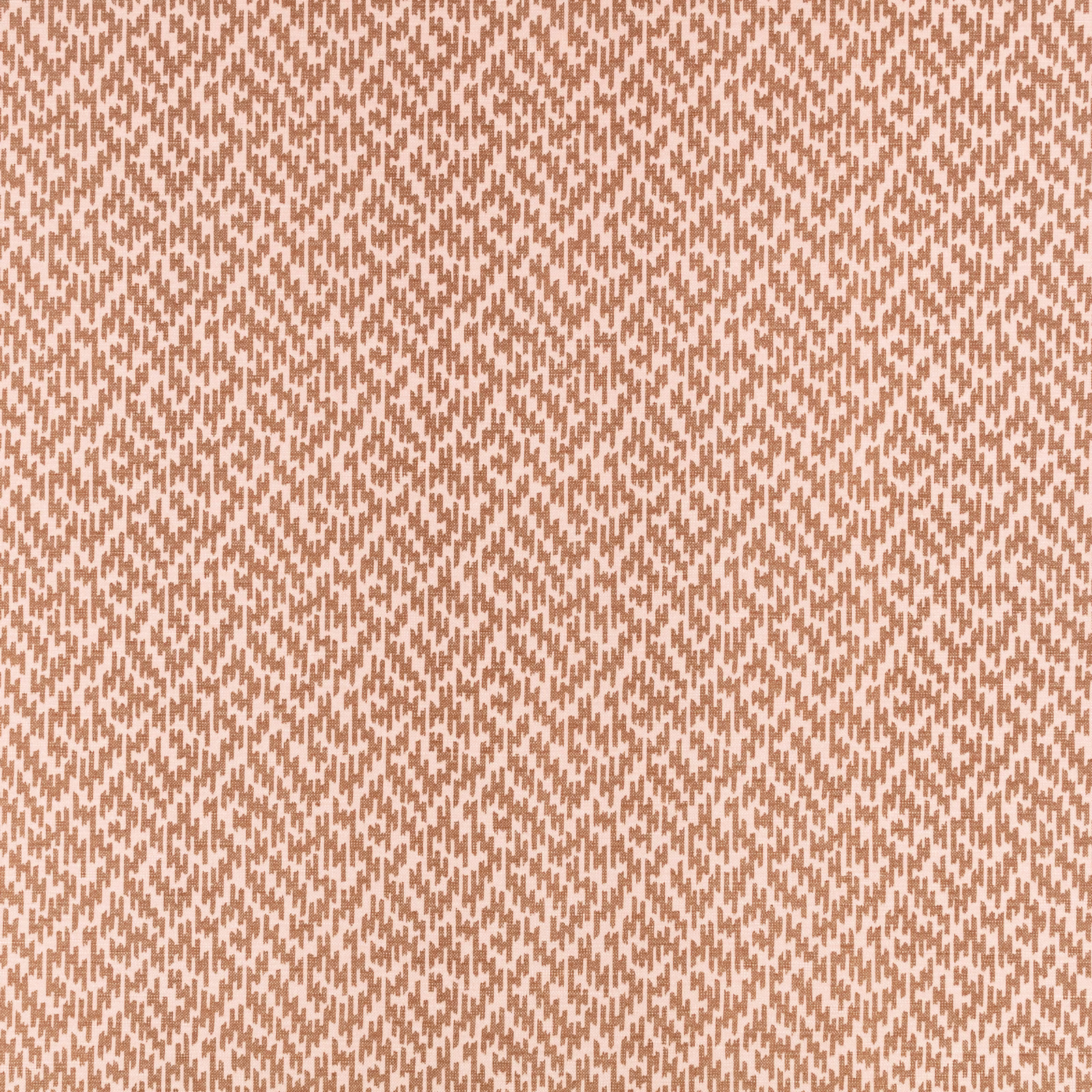 Warm cinnamon and ivory woven fabric with a small broken geometric motif