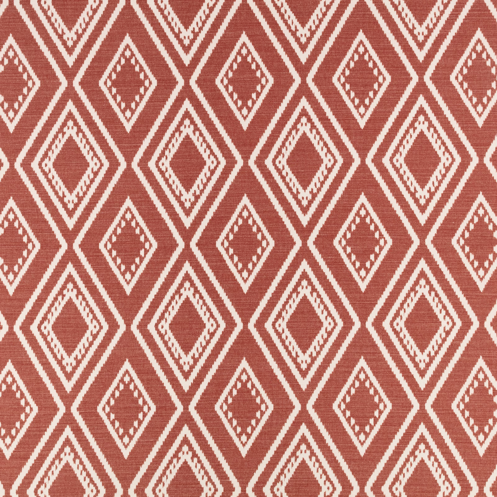 Warm russet woven fabric with cream stepped diamond motifs and fine horizontal texture