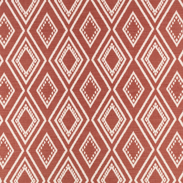 Warm russet woven fabric with cream stepped diamond motifs and fine horizontal texture