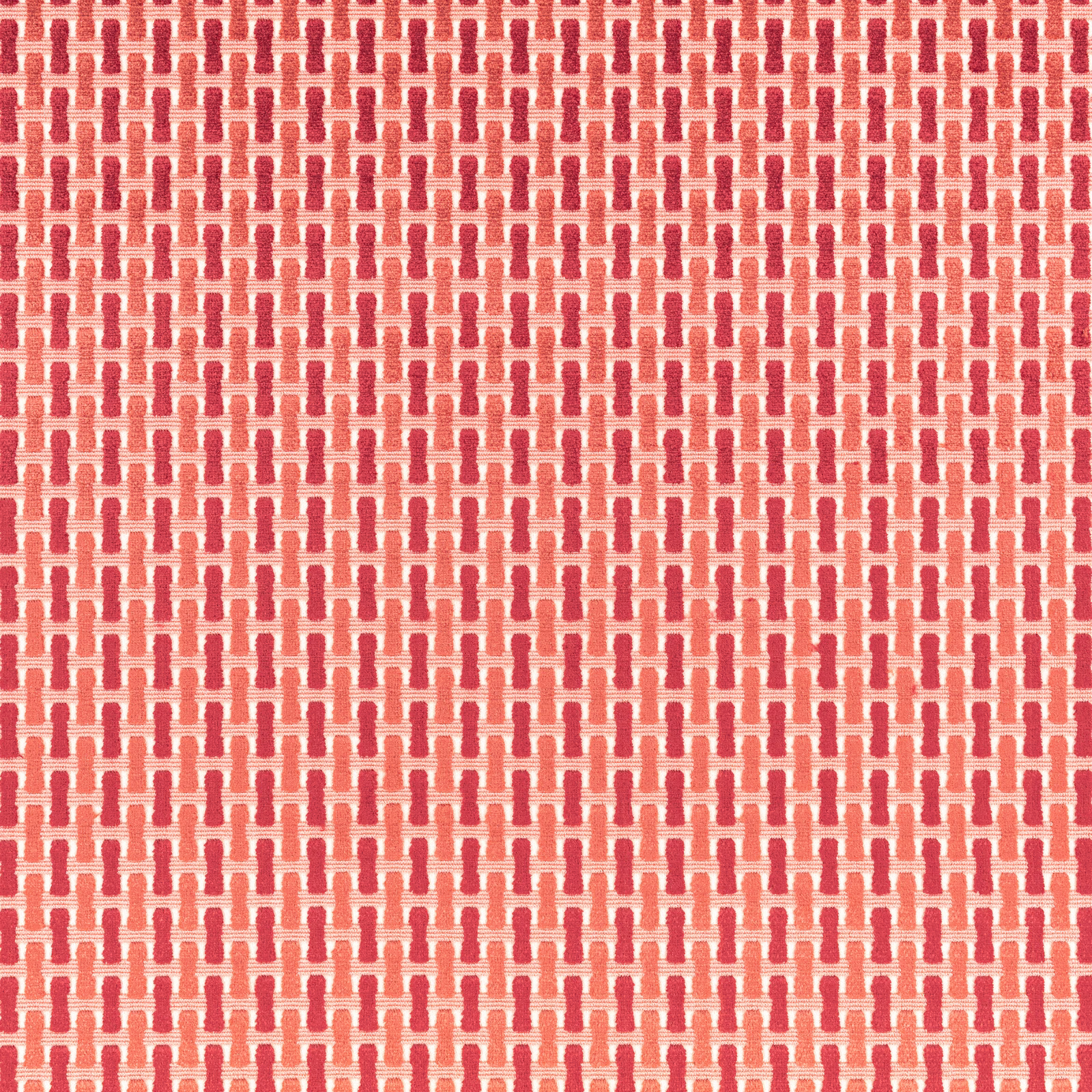 Warm coral-red and cream woven geometric repeat with tactile raised texture