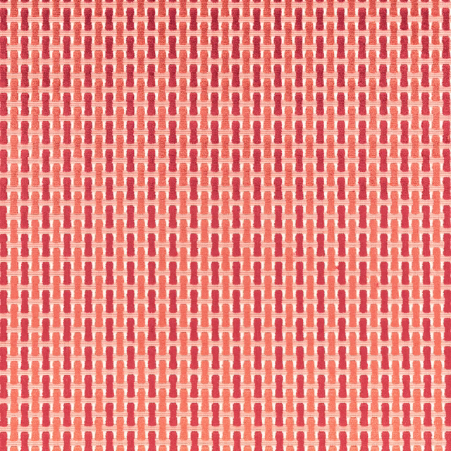 Warm coral-red and cream woven geometric repeat with tactile raised texture