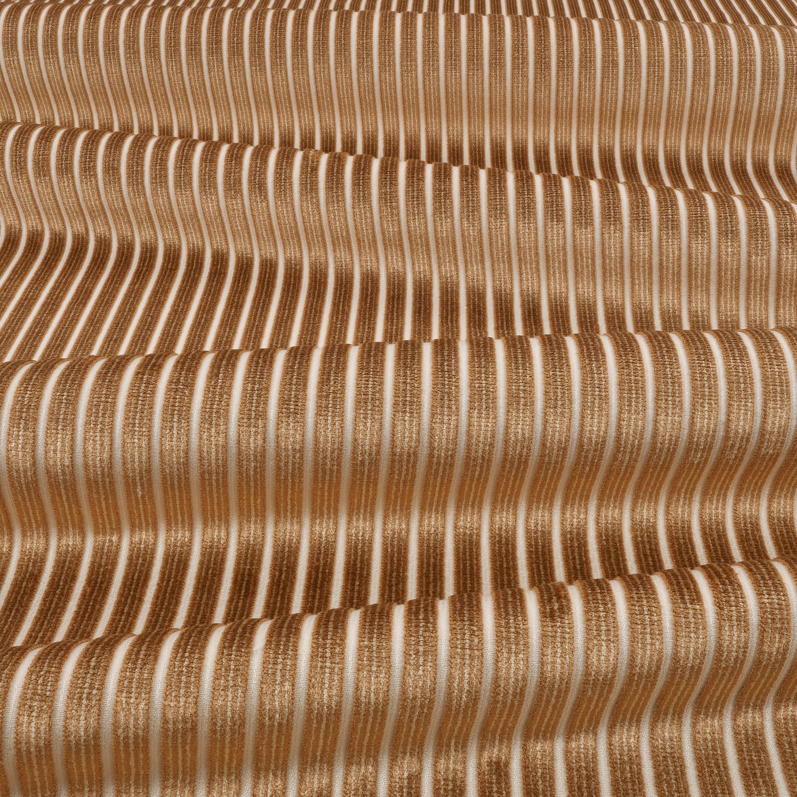 Warm copper and ivory undulating vertical stripes in a tactile textured weave