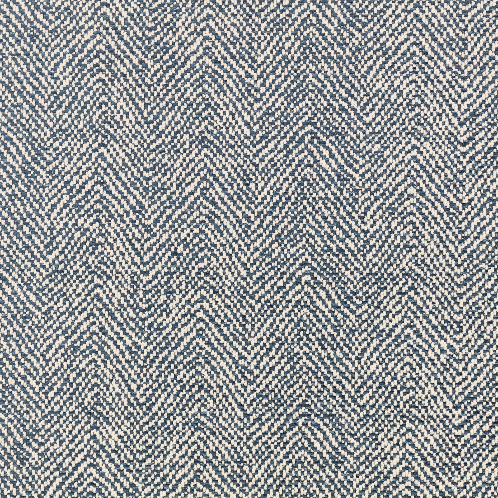 Close-up of Okeyo Bilberry showing a blue-grey and cream broken herringbone weave