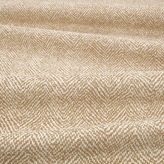 Warm tawny and cream chevron weave with a raised, tactile surface
