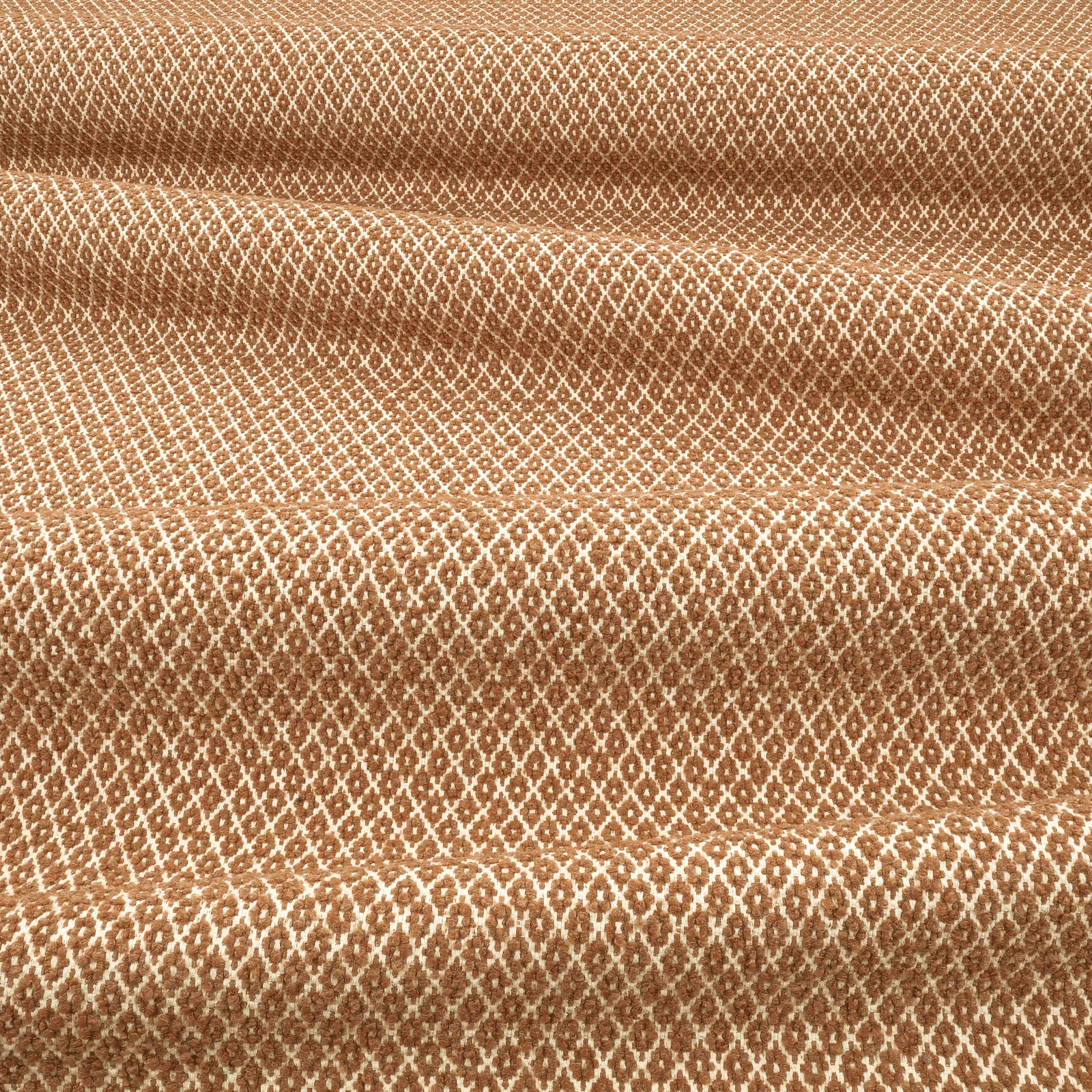 Warm ginger-brown woven fabric with cream diamond lattice and raised tactile texture