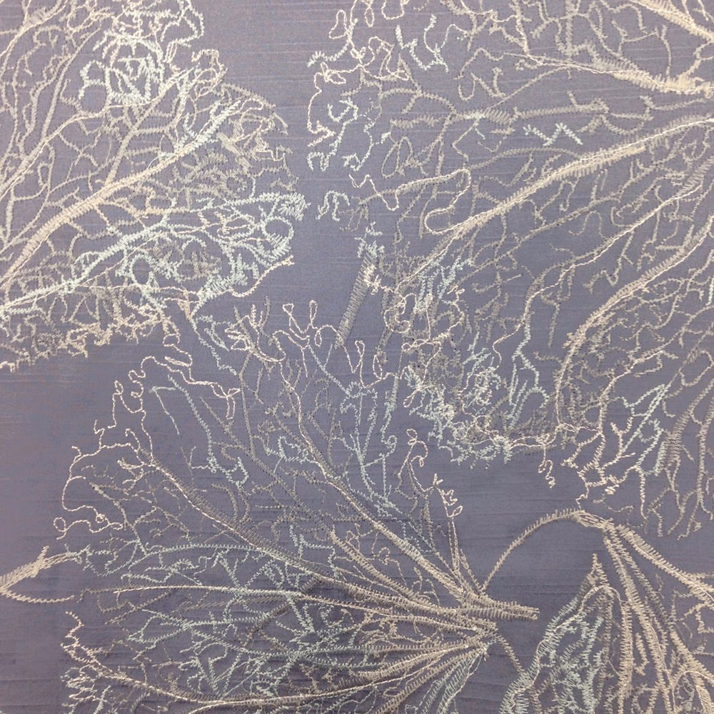 Smoky purple fabric swatch with pale embroidered botanical leaves
