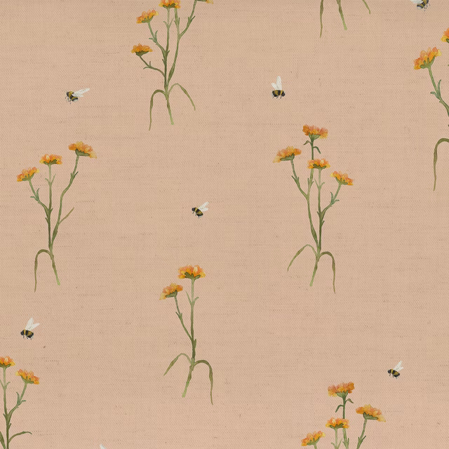 Pale apricot botanical fabric with green stems, orange flowers and small bees