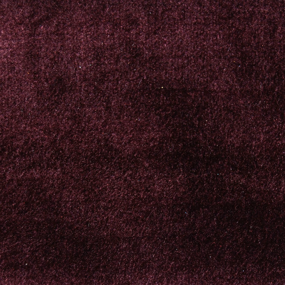 Deep berry-pink textured fabric with a soft velvety surface