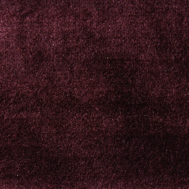 Deep berry-pink textured fabric with a soft velvety surface