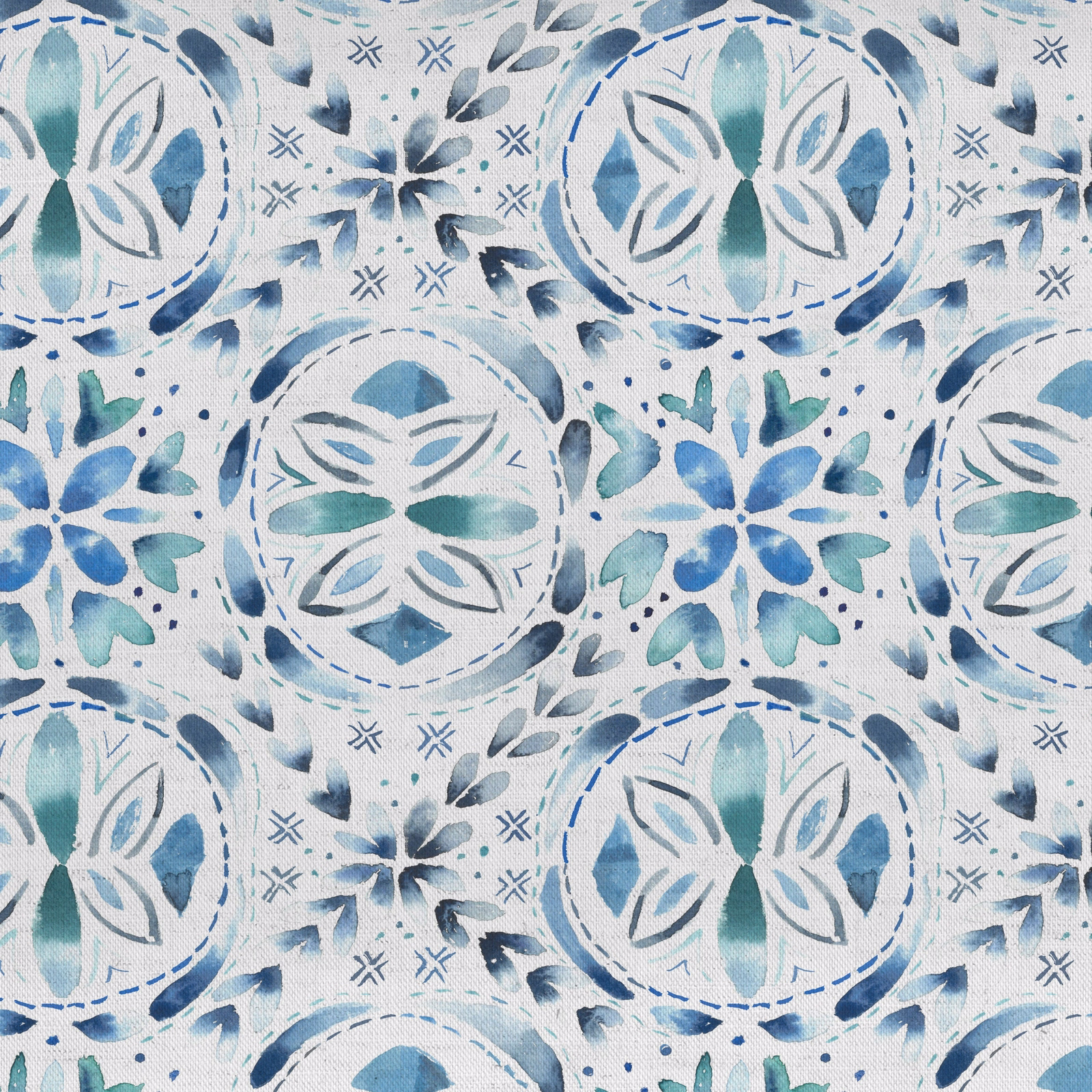 Blue and teal folk floral medallion fabric on a pale ground