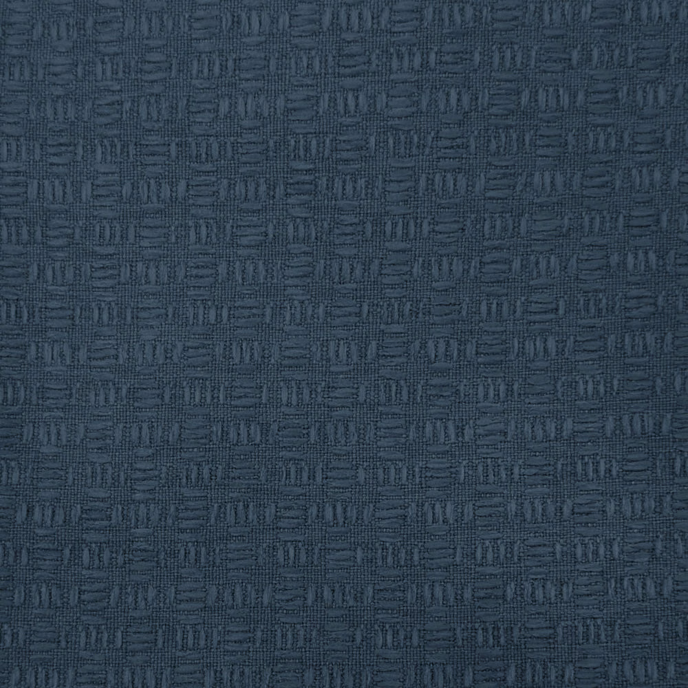 Muted slate blue woven fabric with a small geometric grid texture