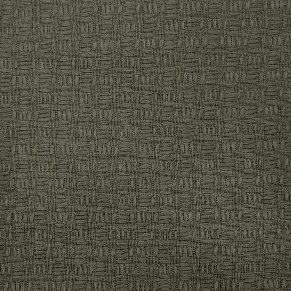 Close-up of muted olive-brown woven fabric with small repeating textured blocks