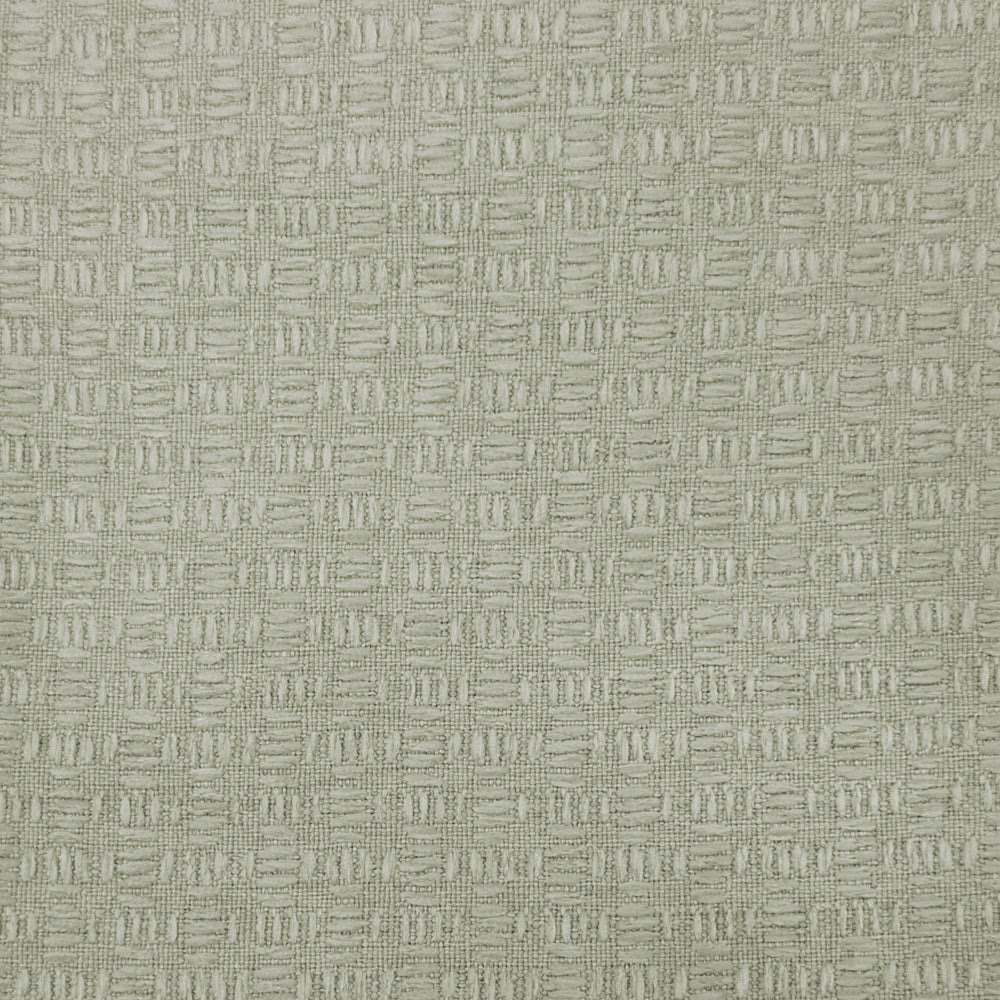 Close-up of a soft warm cream woven fabric with a small geometric texture