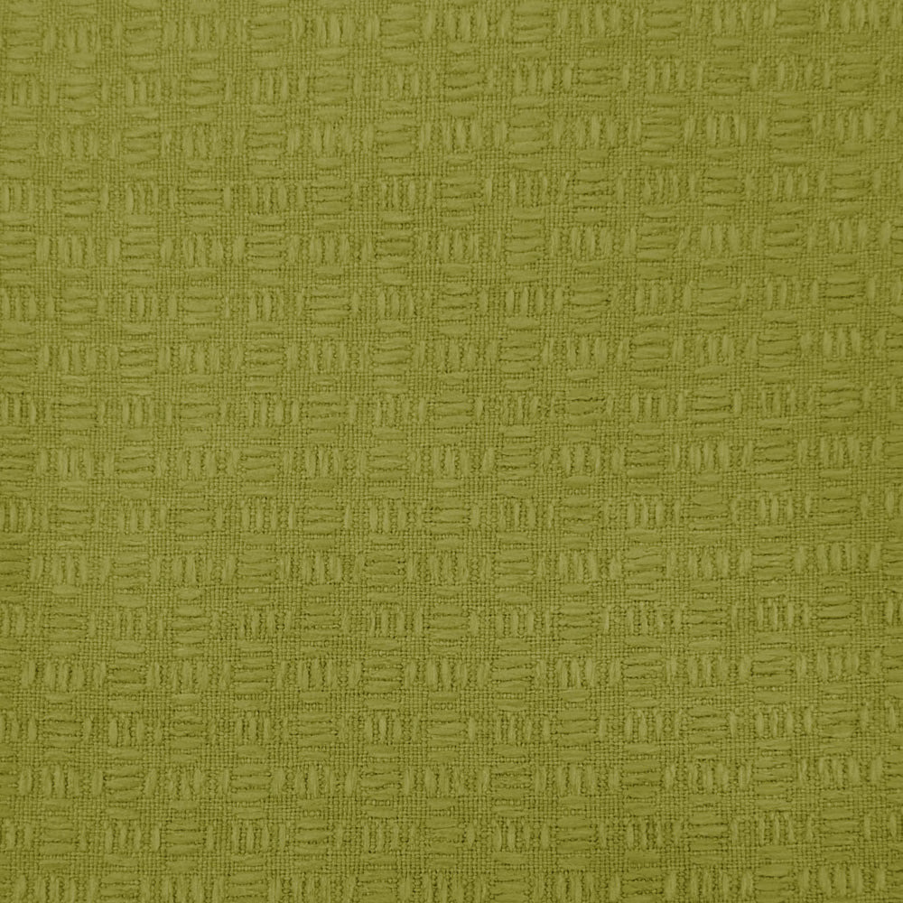 Close-up of a yellow-green textured woven fabric with small geometric pattern