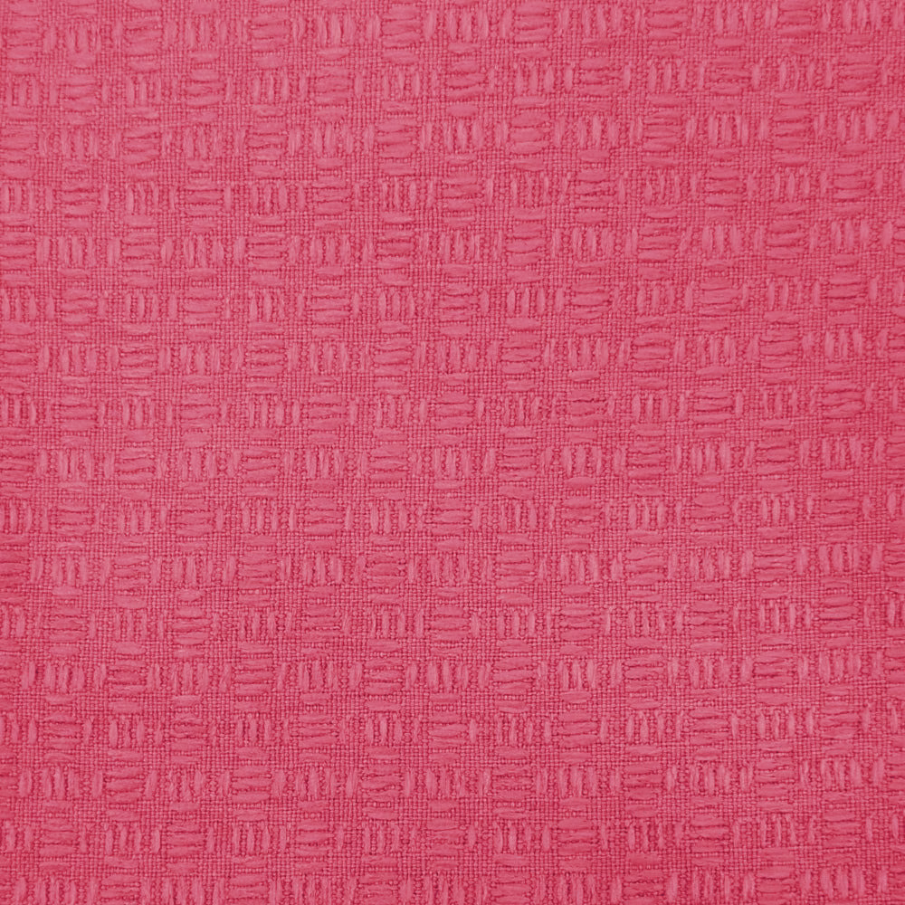 Bright raspberry pink textured woven fabric with a small geometric grid pattern