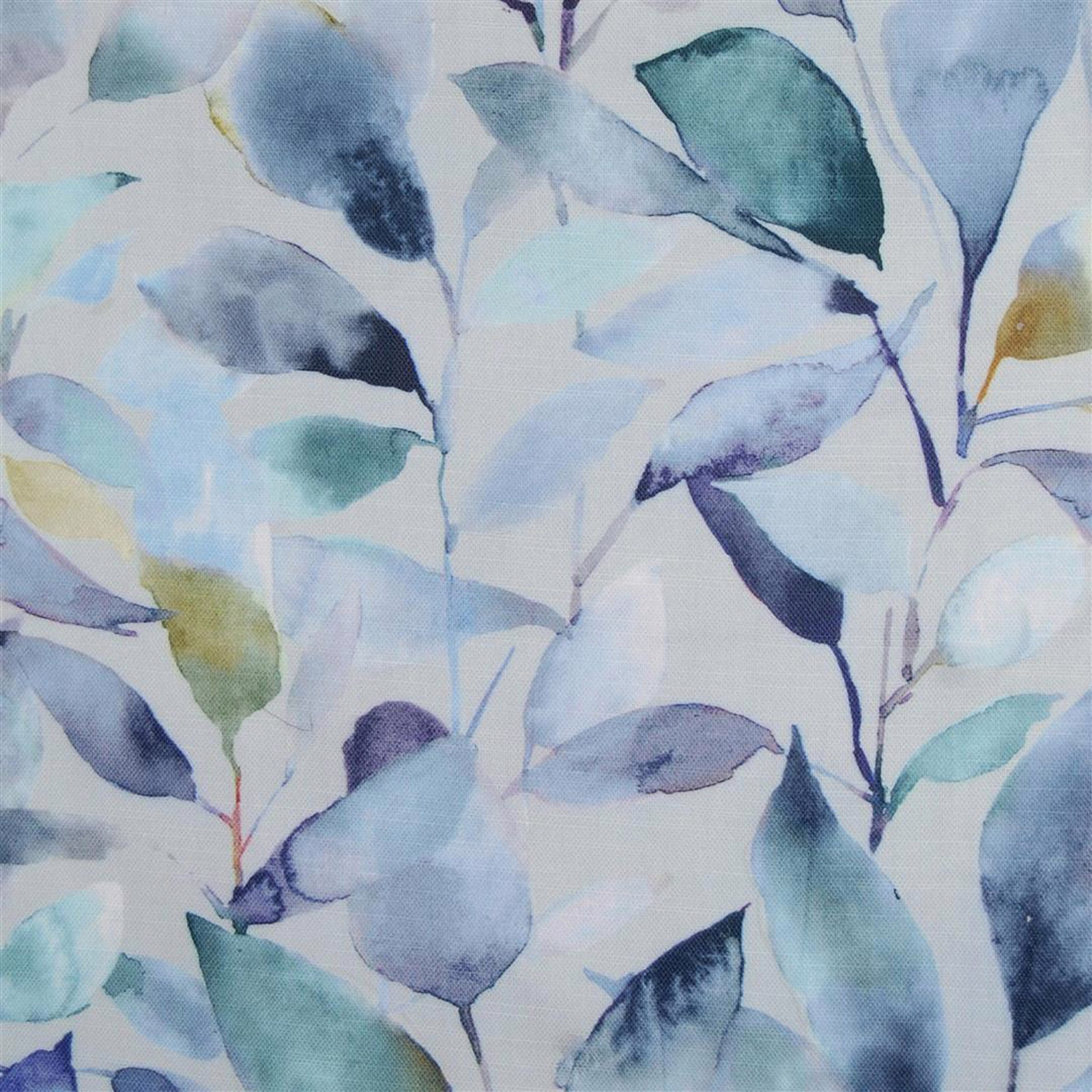 Painterly leaf-print fabric in pale blue, teal and navy on a light ground