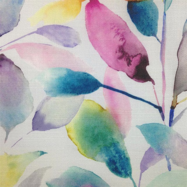 Watercolour leaf print in pink, aqua, lilac, yellow and green on a pale ground