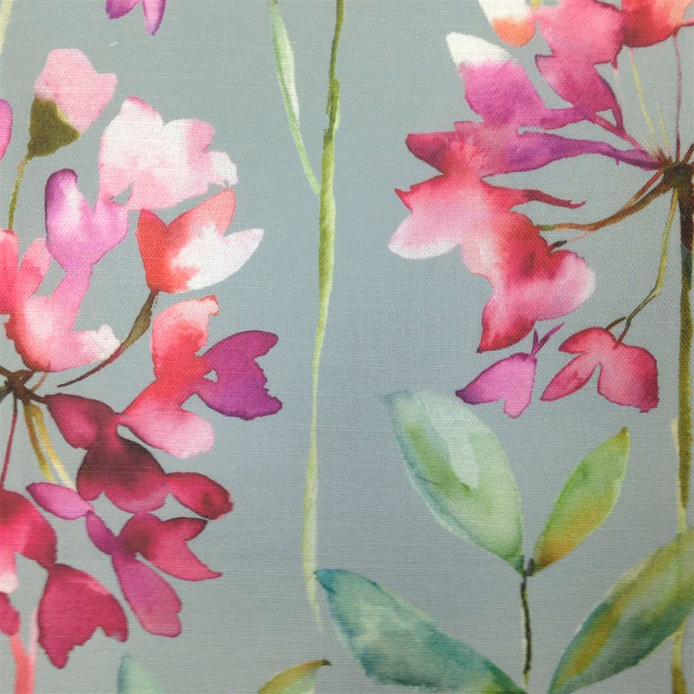 Painterly pink floral fabric on a pale blue-grey ground with green stems and leaves