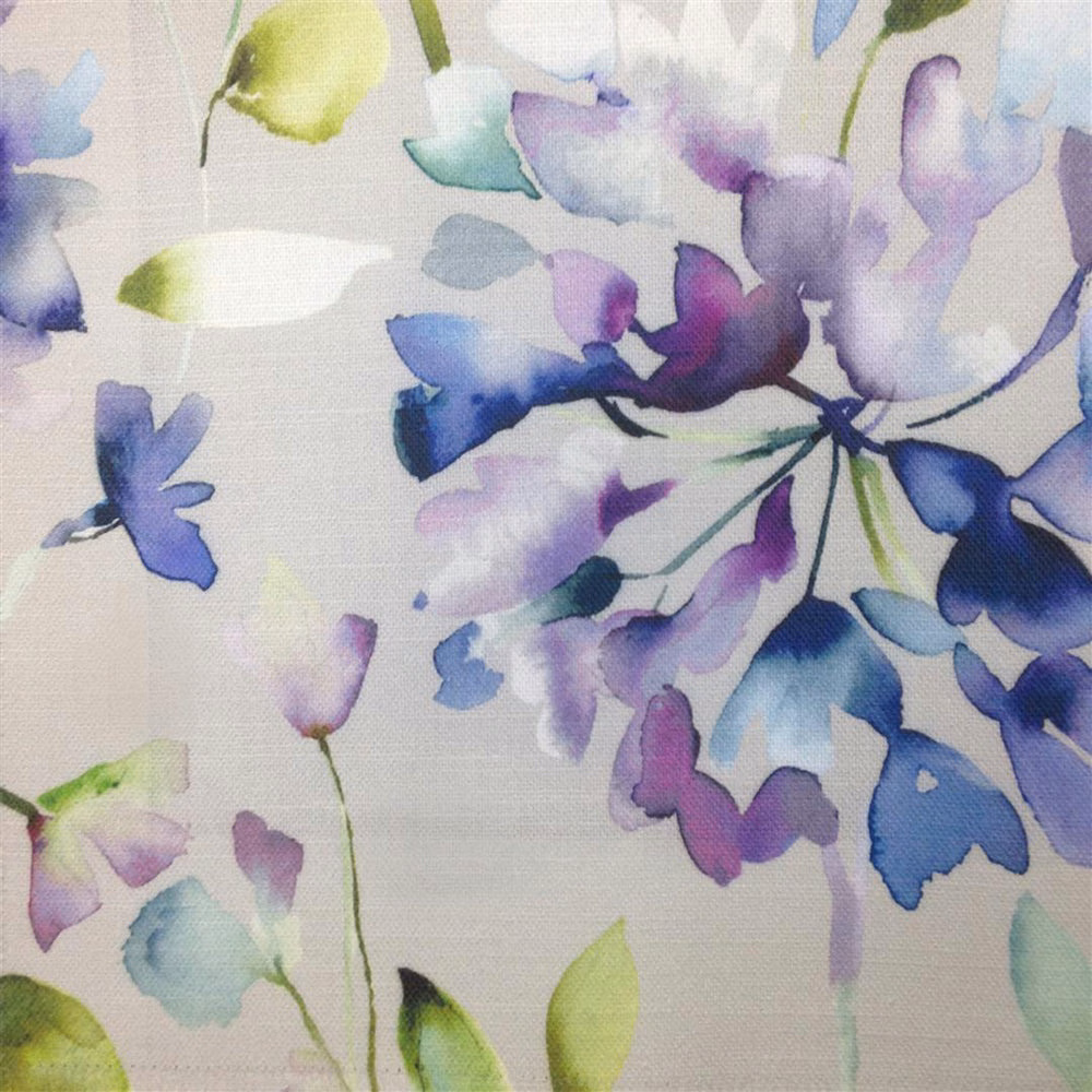 Painterly lilac and blue floral print on a pale ground, with soft woven texture