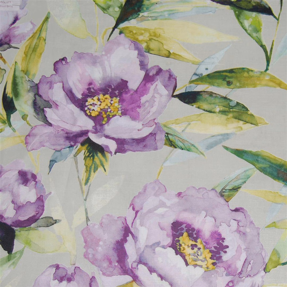 Watercolour lilac floral fabric with green leaves on a pale ground