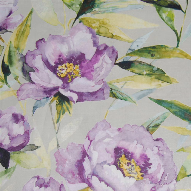 Watercolour lilac floral fabric with green leaves on a pale ground