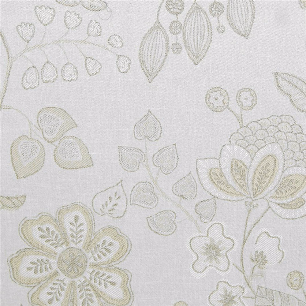 Cream embroidered floral fabric with pale sage leaf and blossom motifs