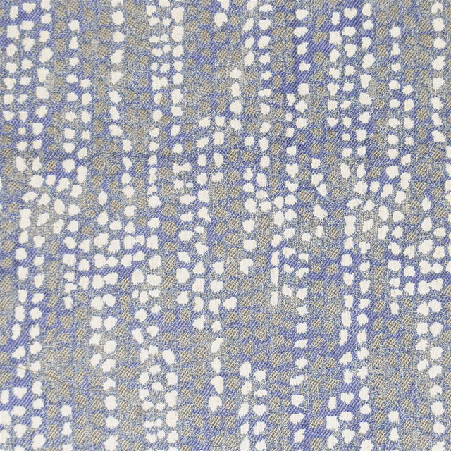 Blue and ivory abstract woven fabric swatch with pebble-like scattered spots
