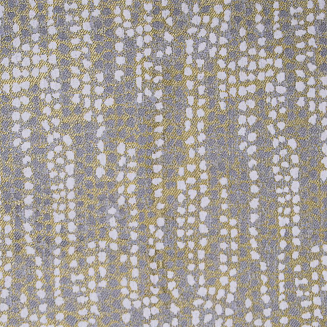Close-up of abstract woven fabric with soft mustard, grey and white speckling