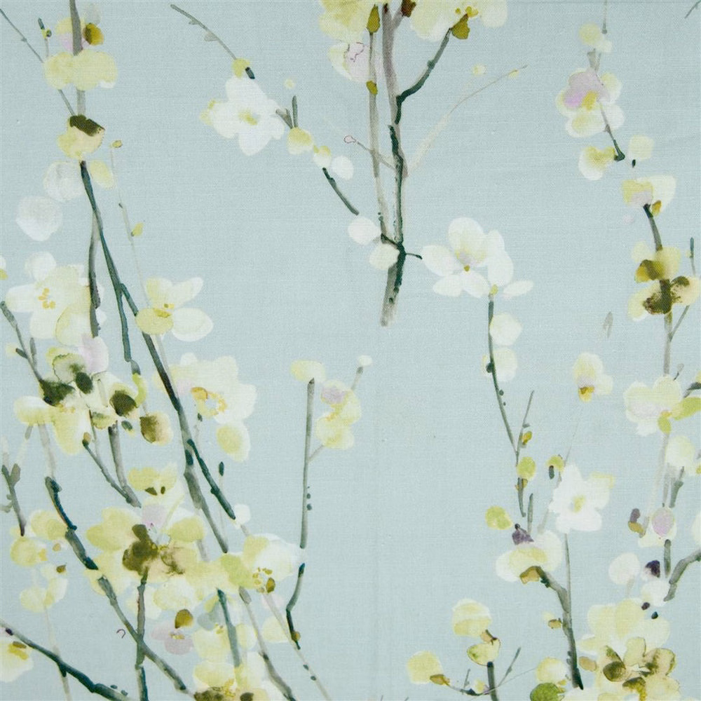 Soft sage-green floral fabric with trailing blossom stems and pale petals