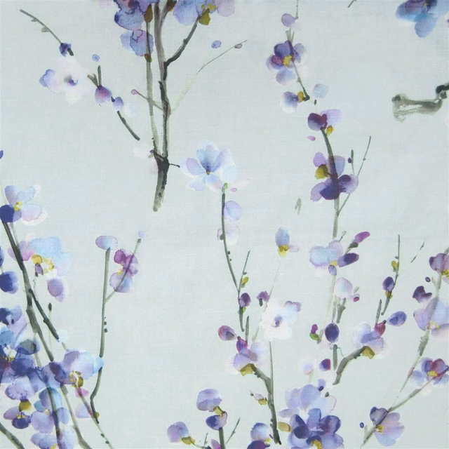 Pale botanical fabric with lilac-purple blossoms and slender grey stems on an ivory ground