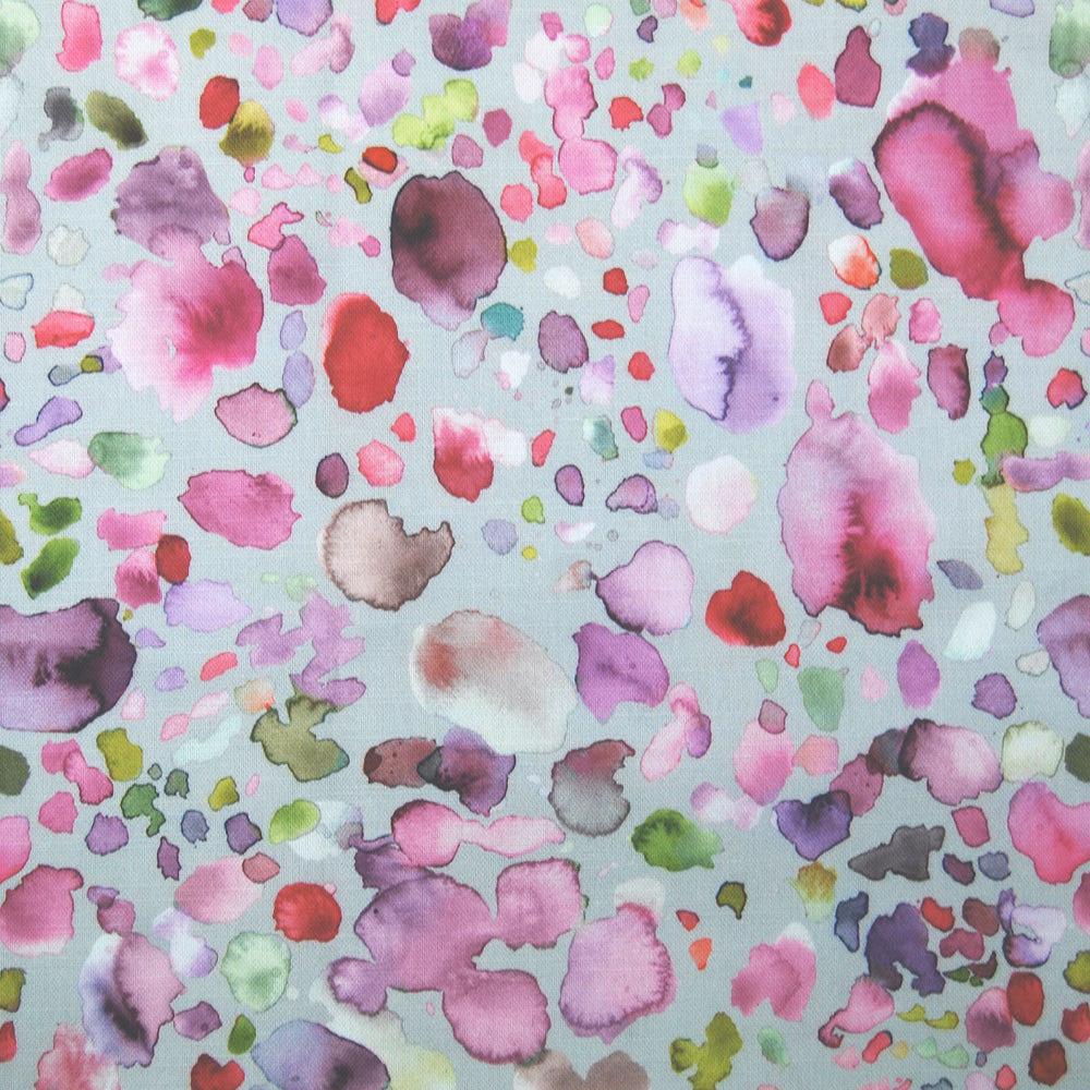 Confetti-style pink, lilac and green painterly spots on a pale mint ground